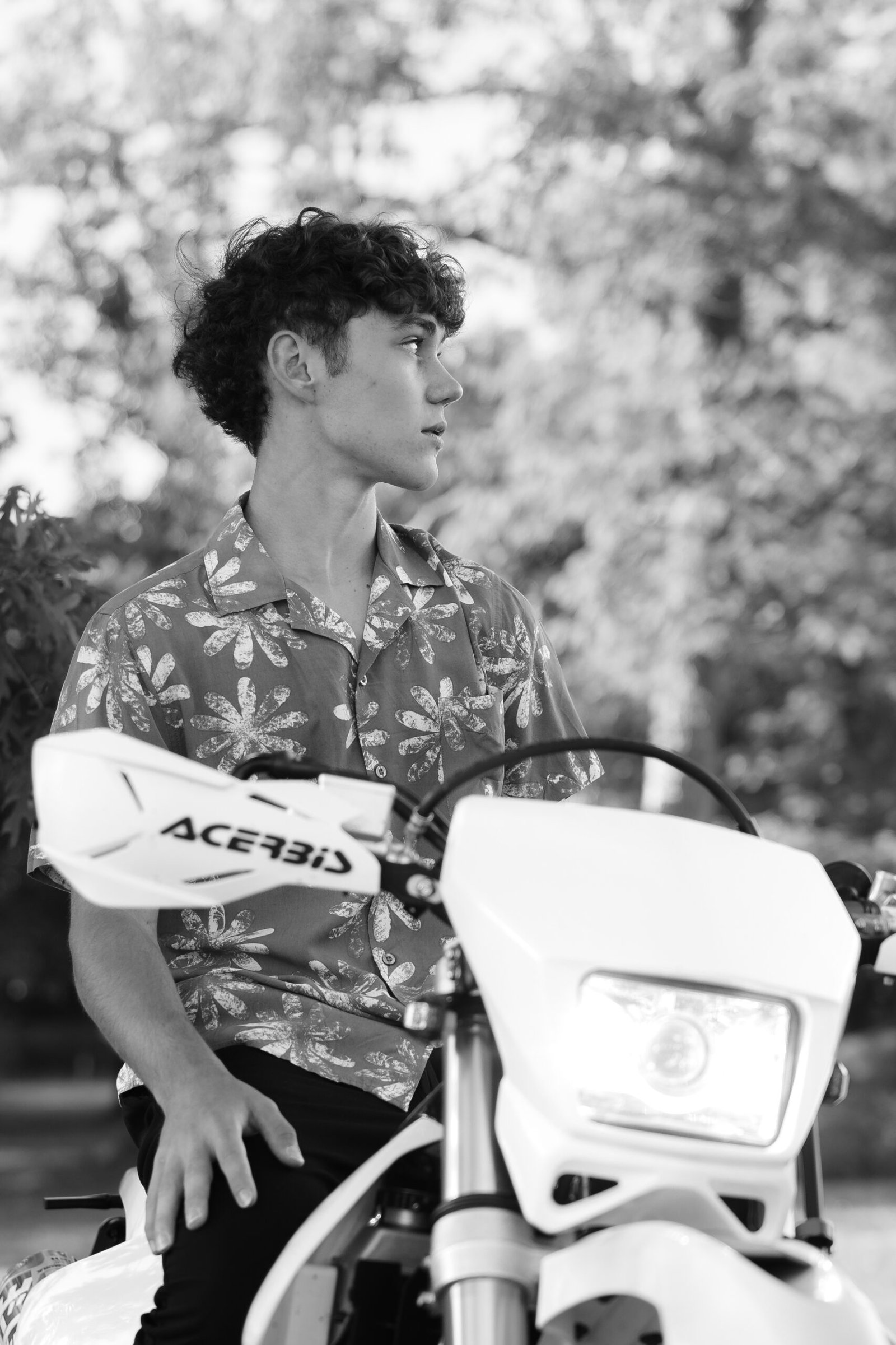 zach_highschoolgrad-13 High school senior portrait sitting on a dirt bike.