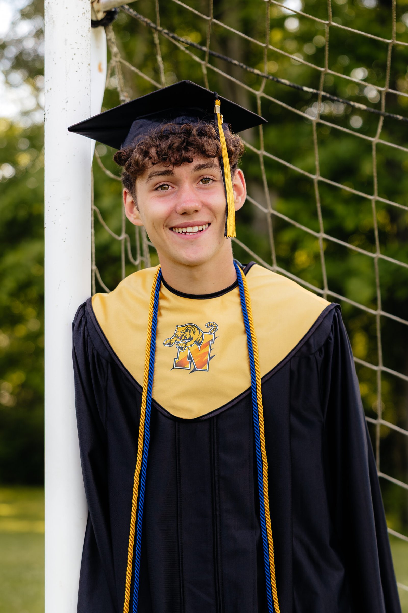 zach_highschoolgrad-8 High school senior outdoor portraits in front of a soccer net.