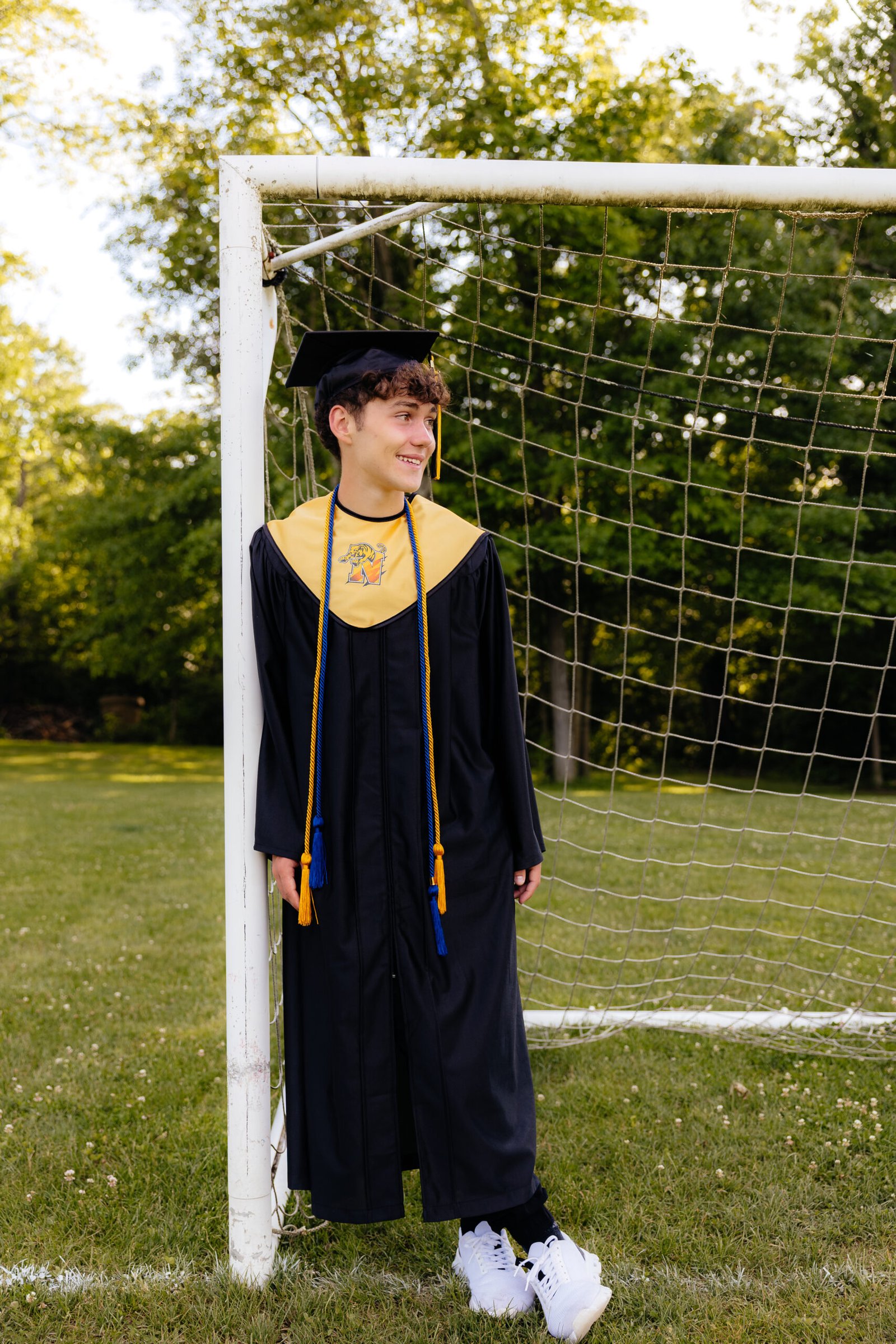 zach_highschoolgrad-9 High school senior outdoor portraits in front of a soccer net.